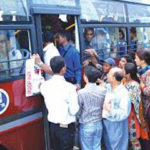 Commuters rushing to board a SPTS bus in the city (ST).