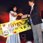 Mylliem legislator RV Lyngdoh hand over the certificate and cheque to the winner of the NE Highway Star Voice Hunt 2011 Ibanisha Pathaw on Saturday (TM)