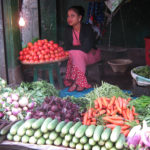 A vendor selling vegetables in Iewduh Market. (ST)