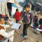 Children attend a class in open