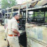 Bus catches fire after collision with truck