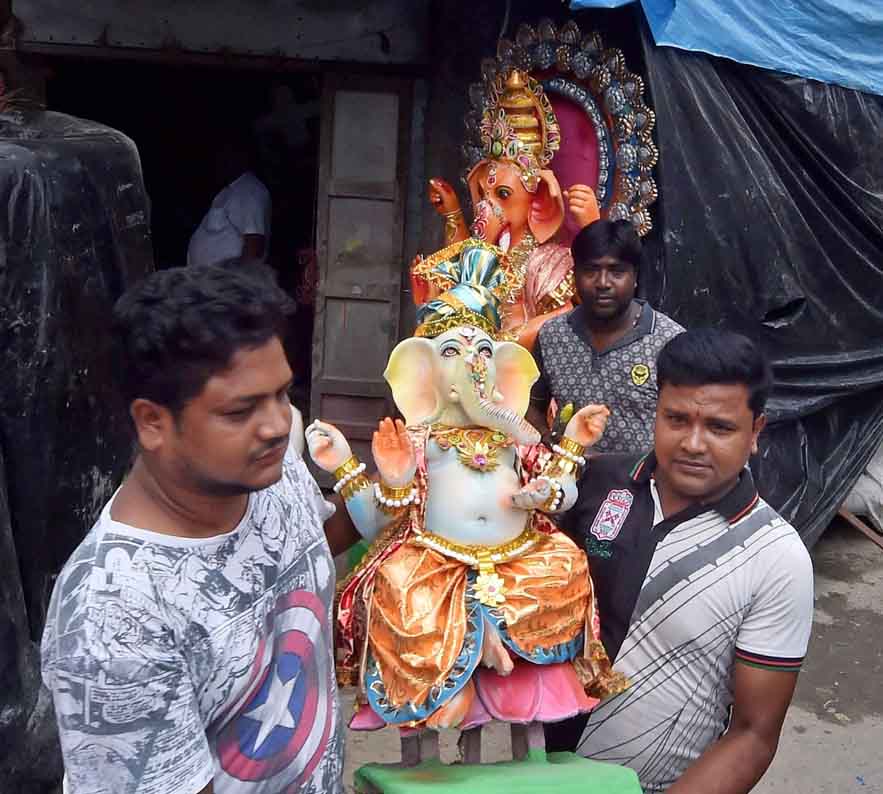 People Carrying The Idol Of Lord Ganesha - The Shillong Times