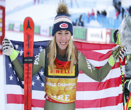 United States’ Mikaela Shiffrin holds her country’s flag as she ...