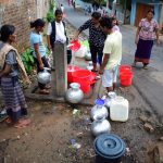 People take turns to collect drinking water from a collection point near Dakopgre in Tura. (ST)