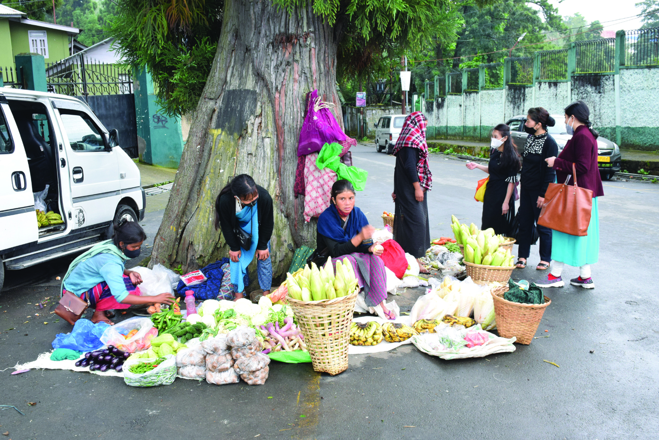 Roadside vendors sell vegetables in the city. - The Shillong Times