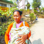 Ganak Marak with her infant son at the community health centre at Dadenggre.