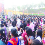 People make their way to the venue through the security check gates at Alotgre ground in Tura on Friday.