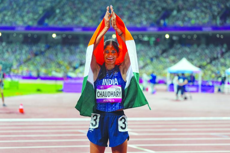 India’s Parul Chaudhary celebrates after winning the gold medal