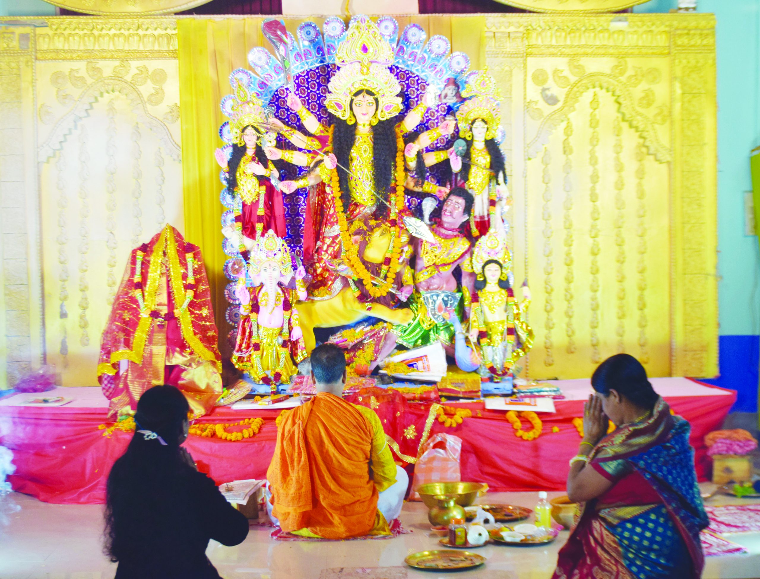 A priest performs rituals on the occasion of Basanti Durga Puja at Jail ...