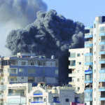 Smoke rises from buildings hit in Israeli airstrikes